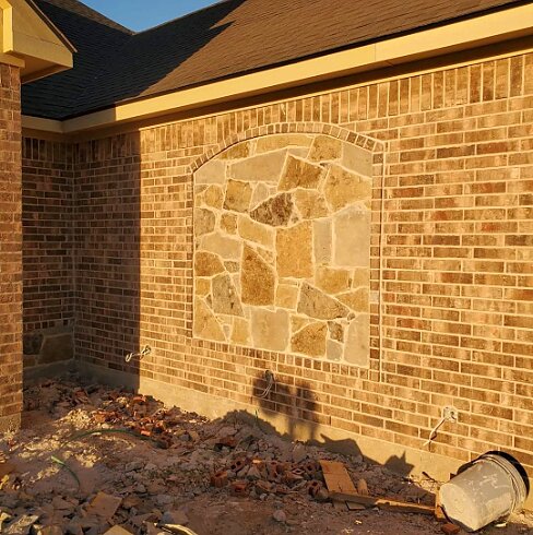 Brick wall with flagstone inlay