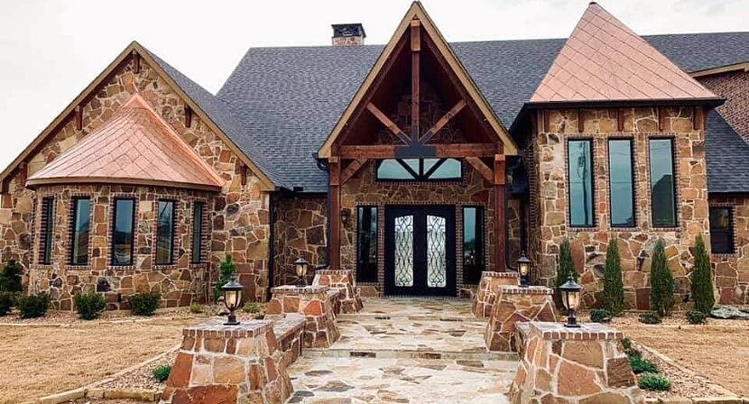 Completed custom stone home entry — masonry by Mendoza